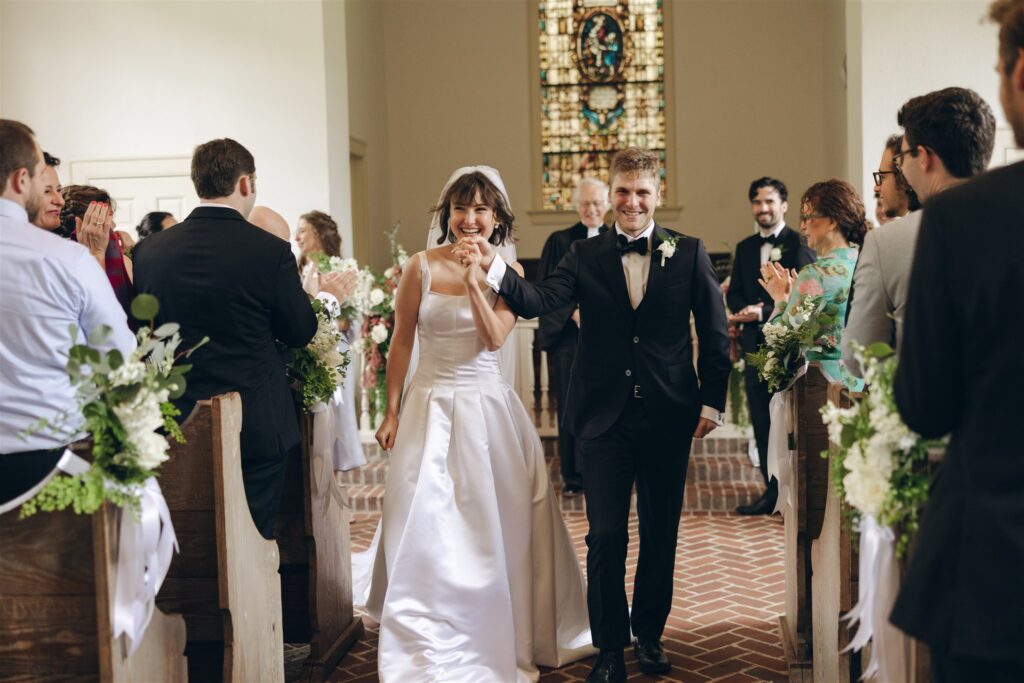 couple heading to their dream timeless wedding reception