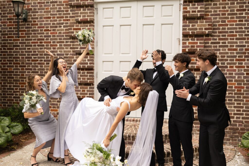 picture of the bride and groom kissing 