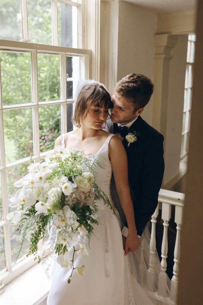 newly married couple hugging before heading to their dream wedding reception