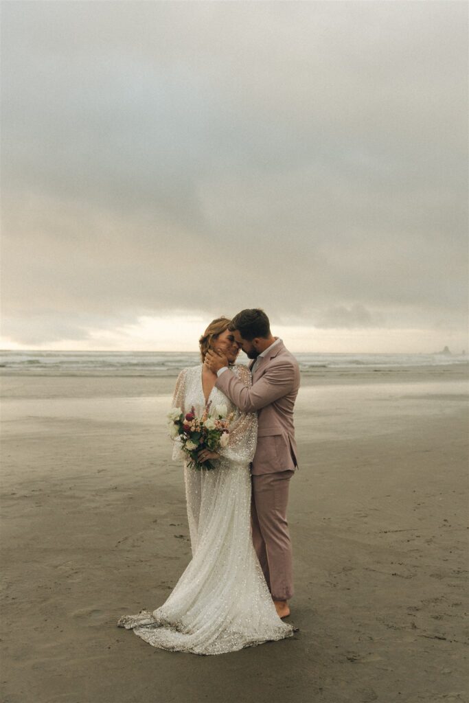 picture of the bride and groom kissing 