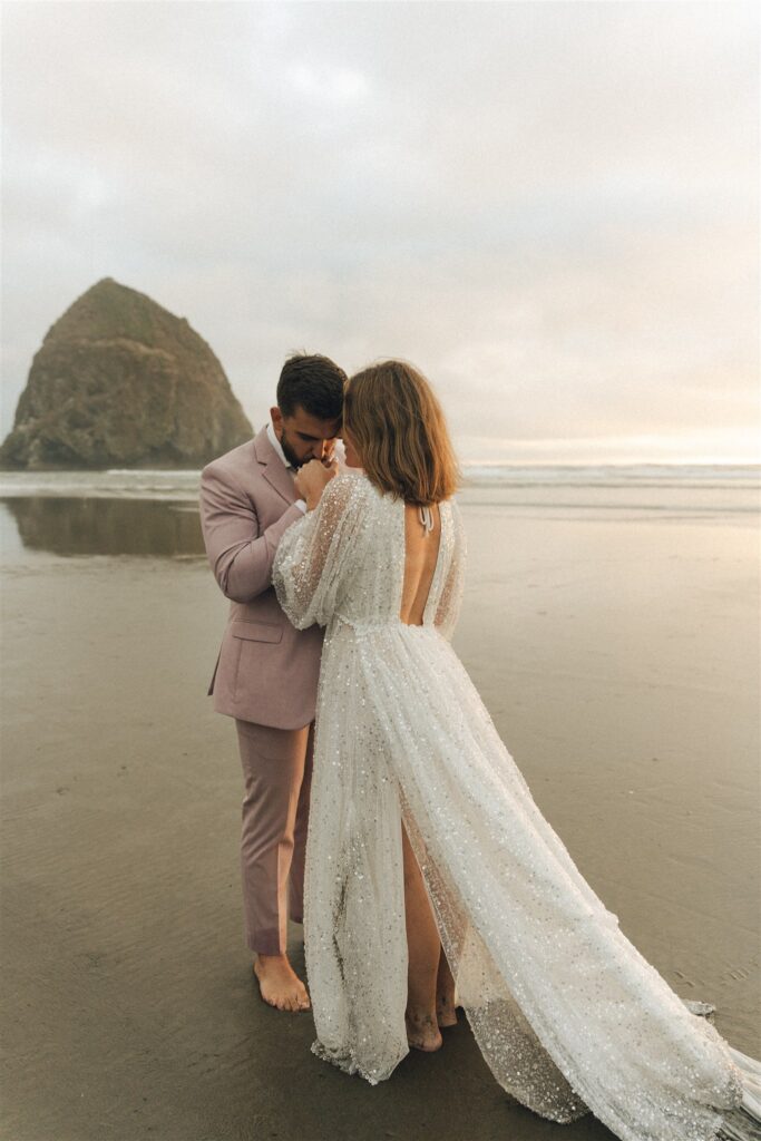 bride and groom hugging at their oregon coast elopement 