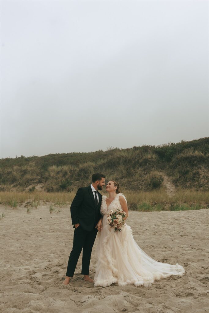 groom kissing the bride on the cheek