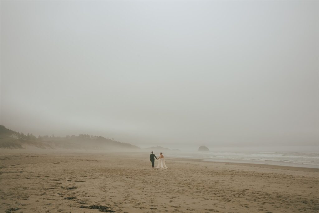 couple walking around the beach during their photoshoot