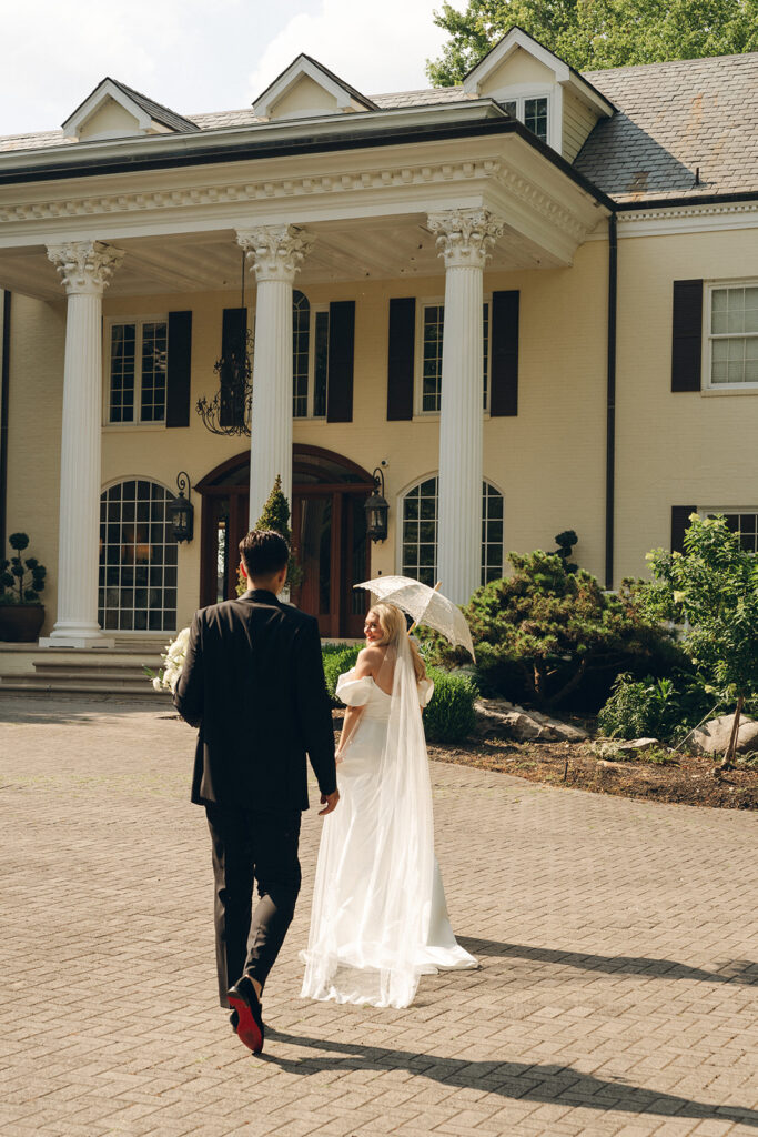 couple walking around their luxurious wedding venue