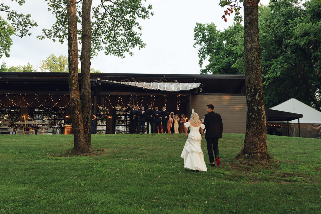 bride and groom heading to their wedding reception