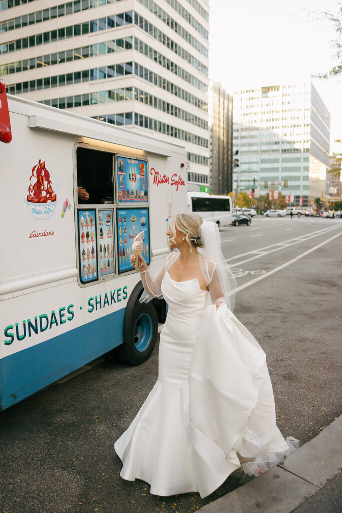 bride buying an ice cream before her reception