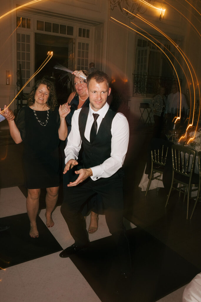 groom dancing at his wedding reception