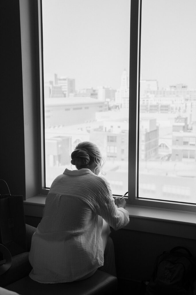 bride writing a letter to the groom before her ceremony 