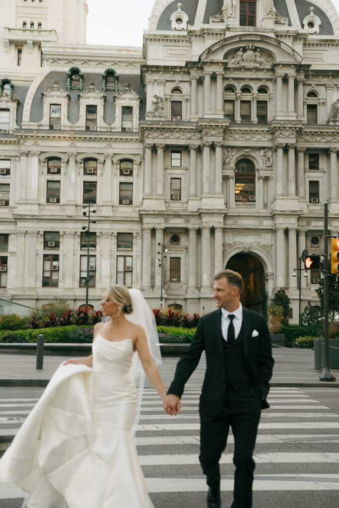 bride and groom holding hands