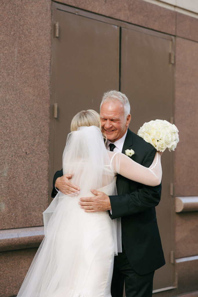 bride and her dad hugging