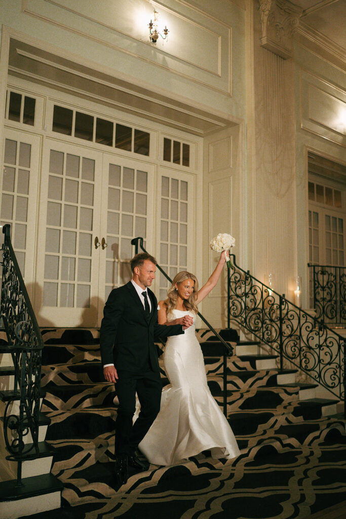 bride and groom arriving at their wedding reception