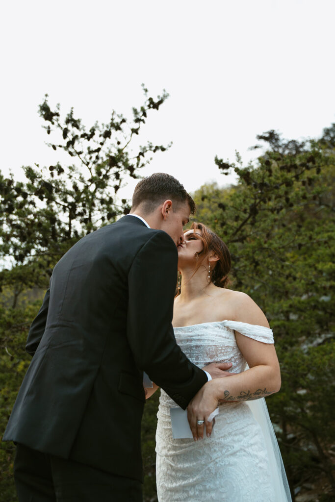 picture of the newlyweds kissing - should you elope?