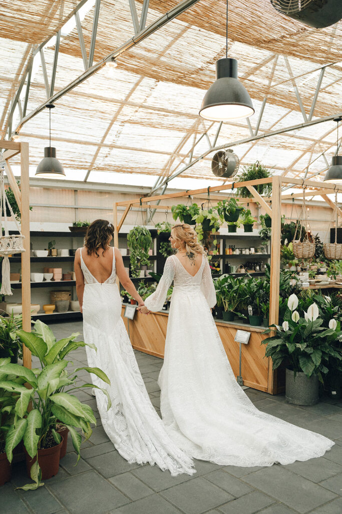 newlyweds walking around a garden 