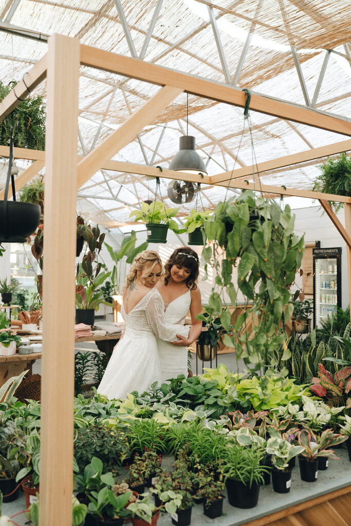 couple looking at plants at their wedding venue 