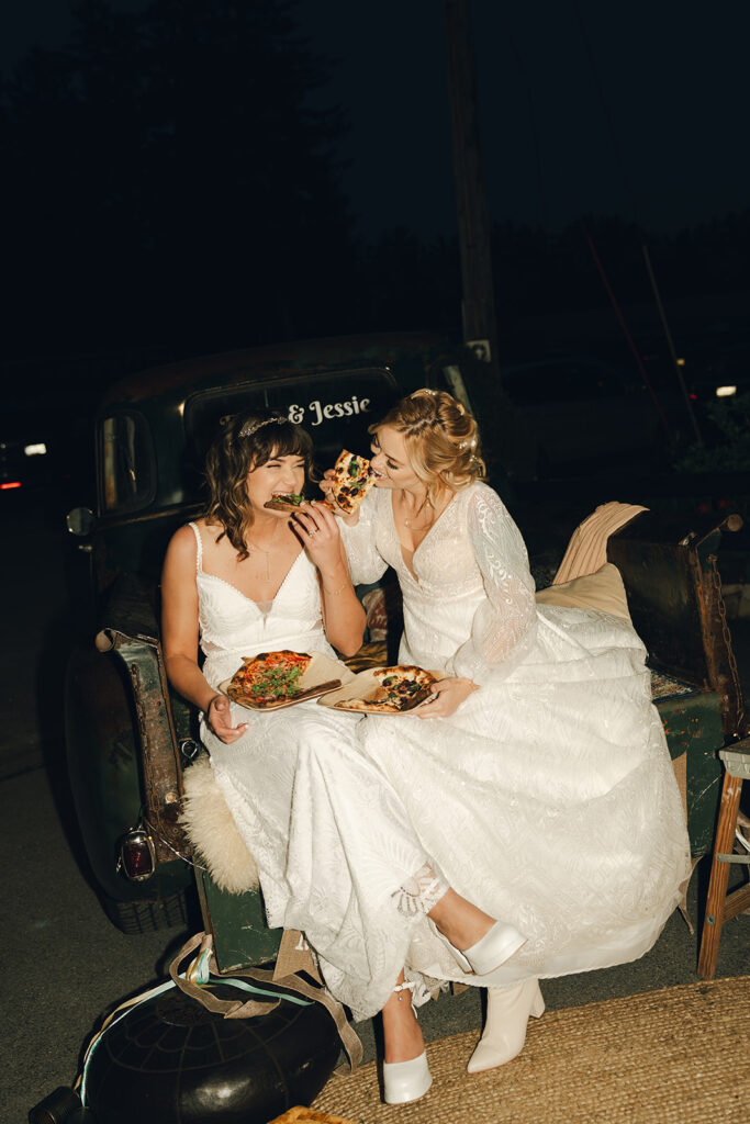 couple eating pizza at their wedding party