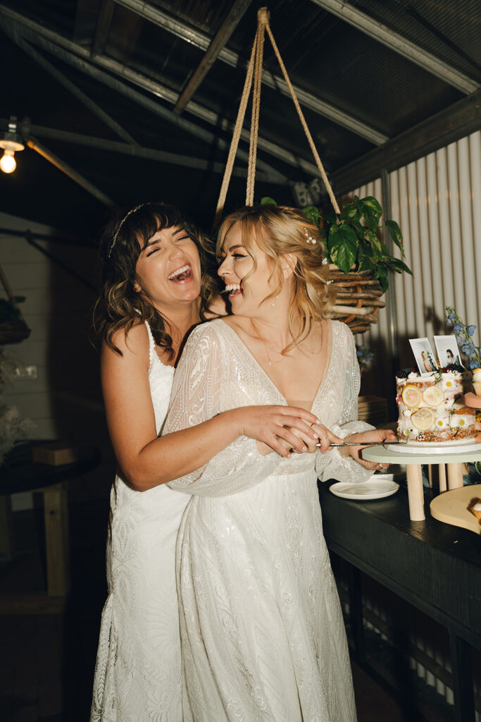 cute picture of the brides laughing 