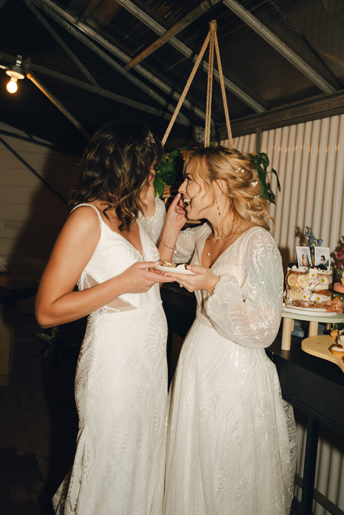 brides trying their wedding cake 