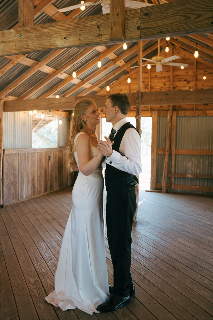 bride and groom first dance at their relaxed wedding day reception