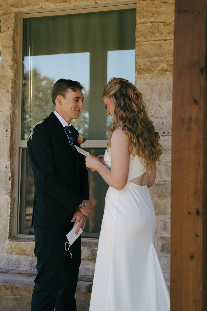 bride and groom reading their private vows