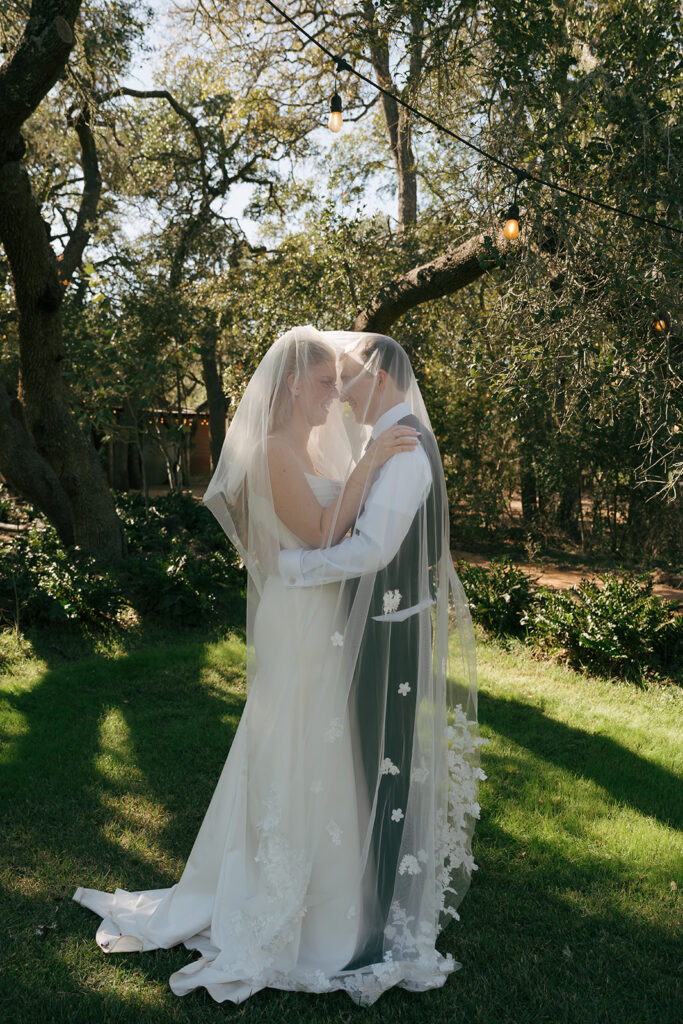 bride and groom looking at each other 