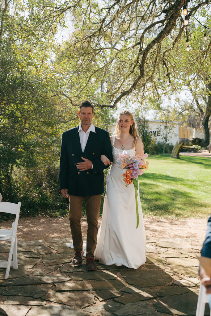 stunning picture of the bride walking down the aisle 