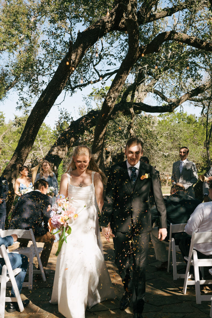 bride and groom heading to their wedding reception