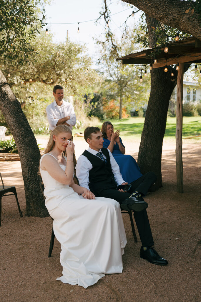 bride and groom emotional at their wedding reception