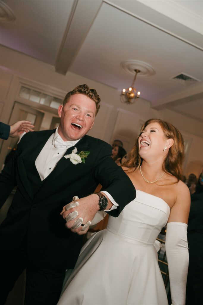 newlyweds entering their wedding reception