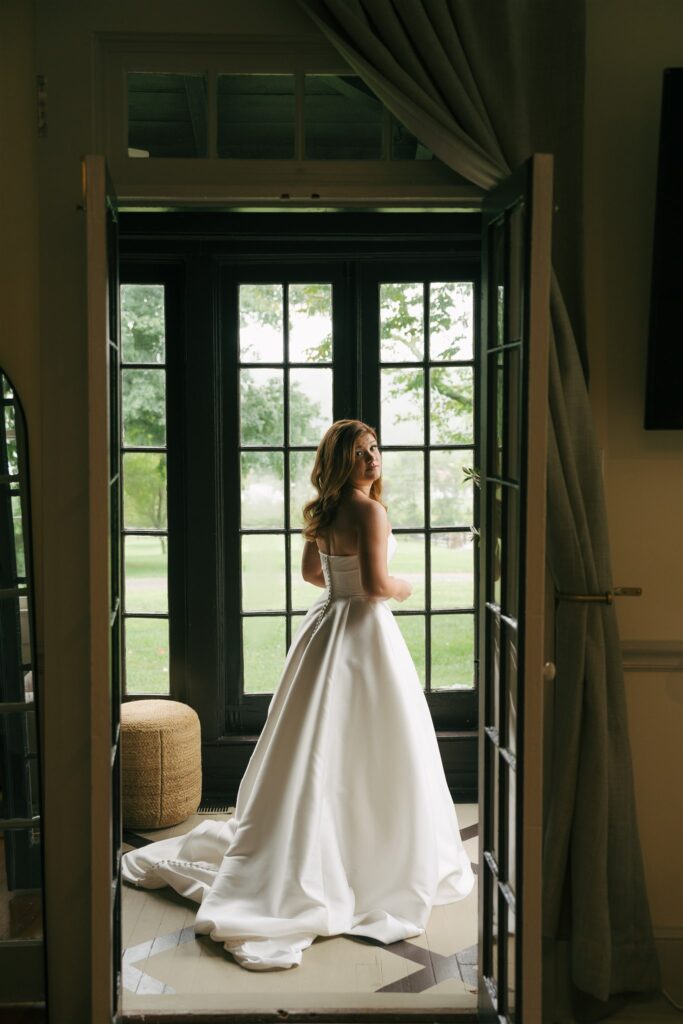 stunning picture of the bride before her coastal style wedding