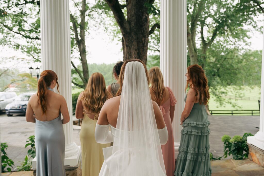 bride and her bridesmaids first look