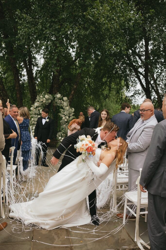 newly married couple kissing