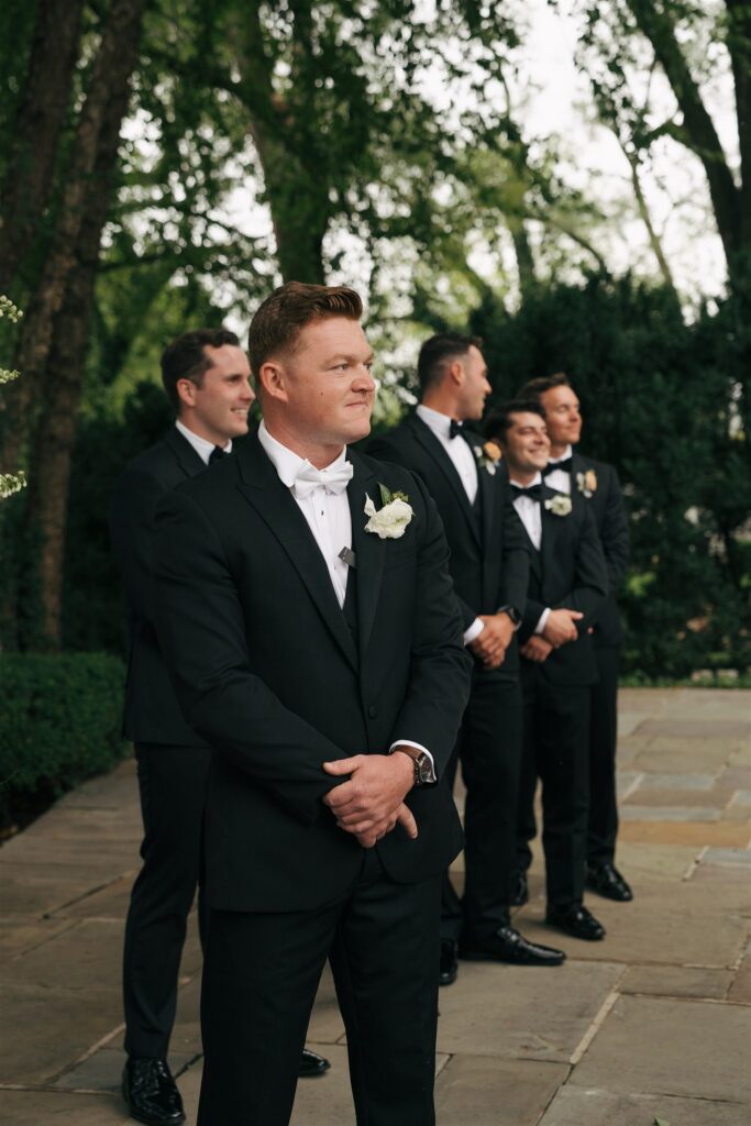 groom emotional watching the bride walk down the aisle 