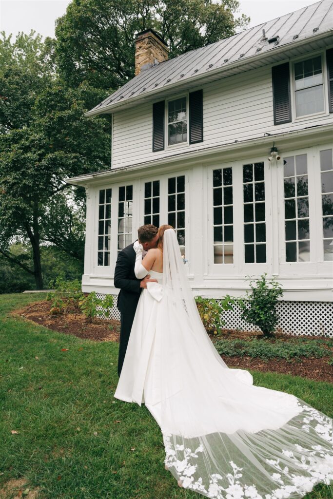 groom kissing the bride on the cheek