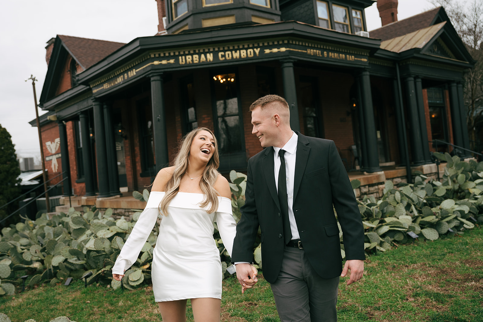 fancy couple walking and laughing