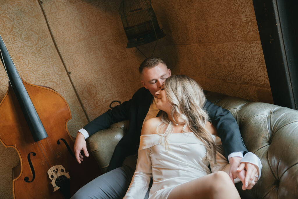 couple snuggled on couch at urban cowboy