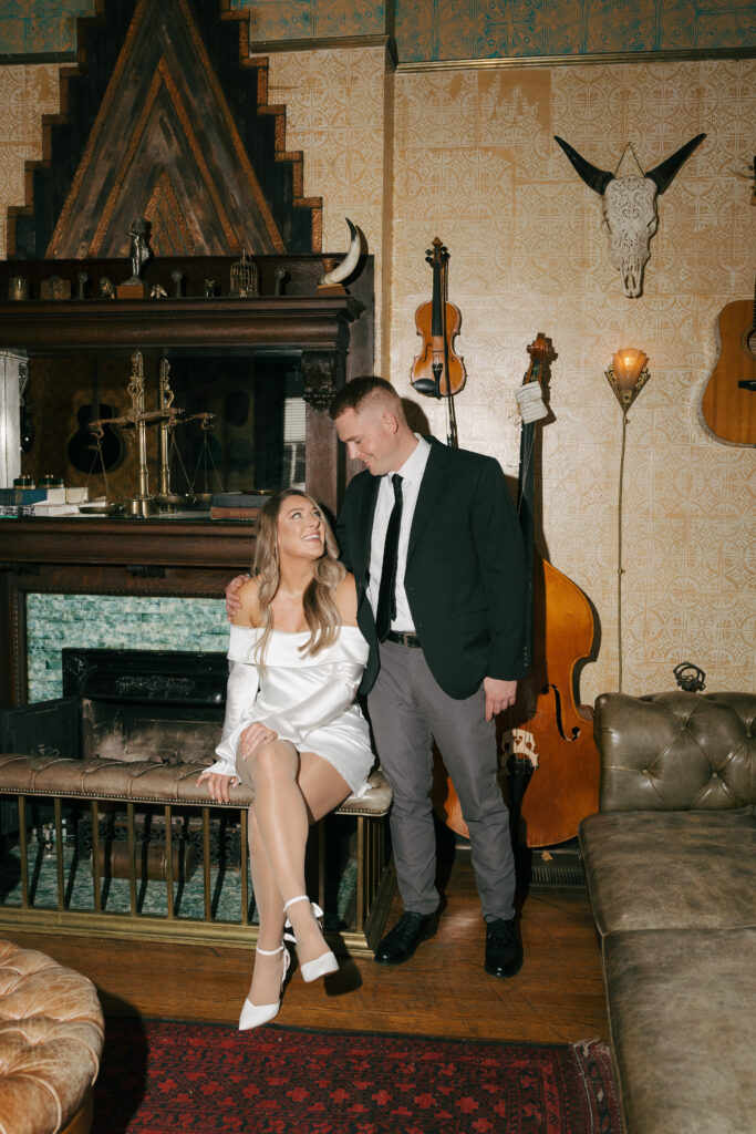 editorial couple photo at a Western themes parlor with flash