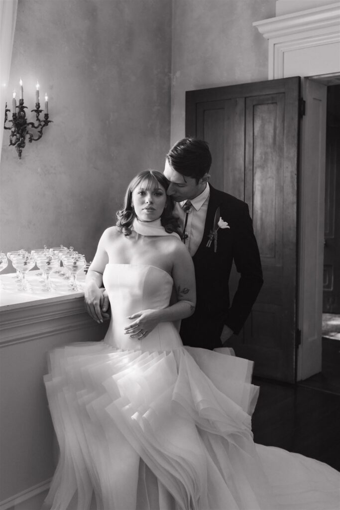 black and white editorial wedding couple at the bar