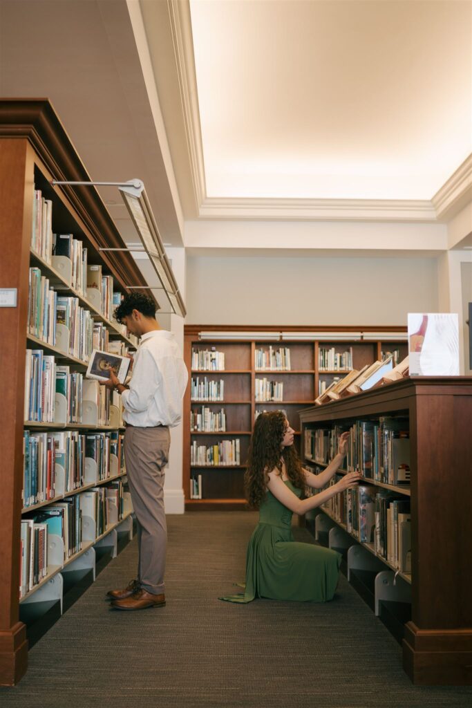 couple looking at books at a public library 