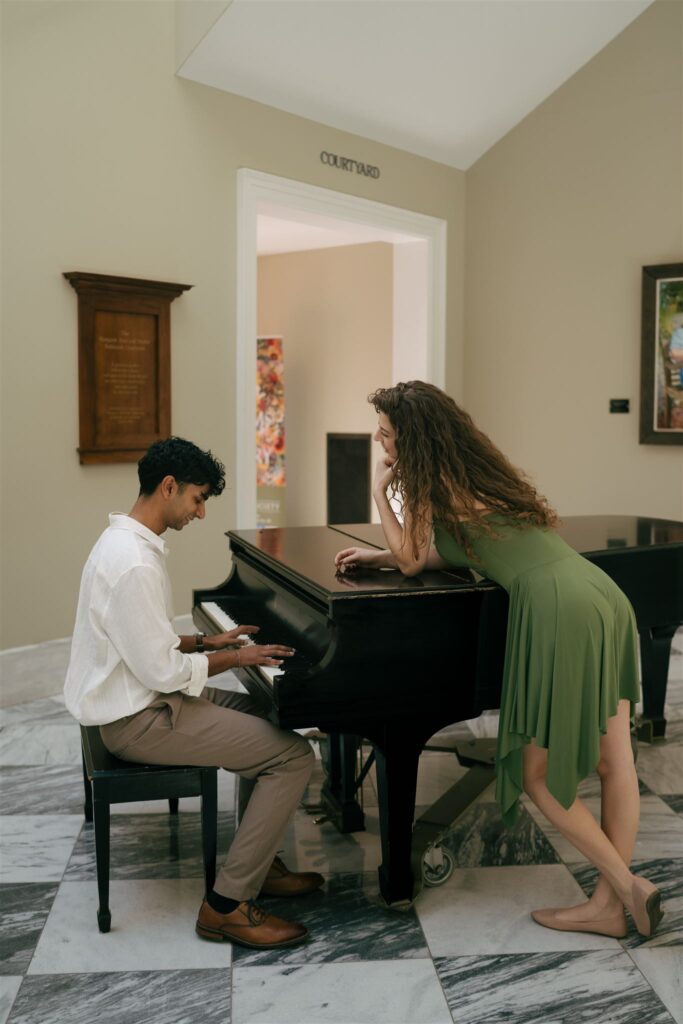 man playing piano for his girlfriend at Nashville public library 