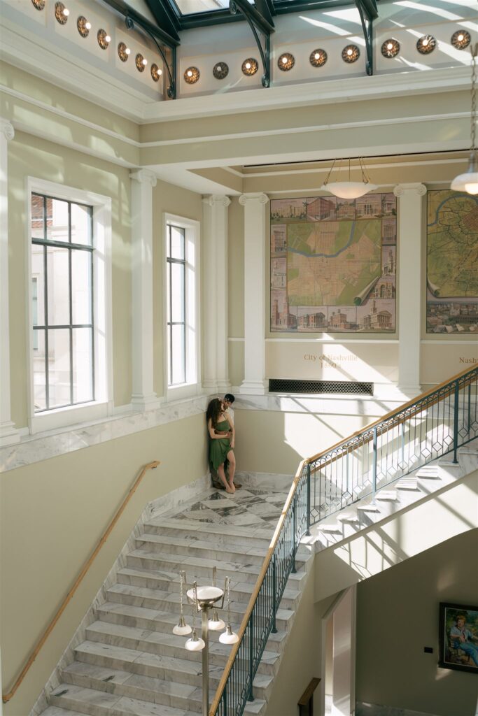 natural light coming through window onto couple hugging at a public library