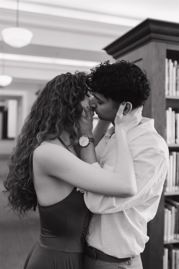 couple kissing at a public library 