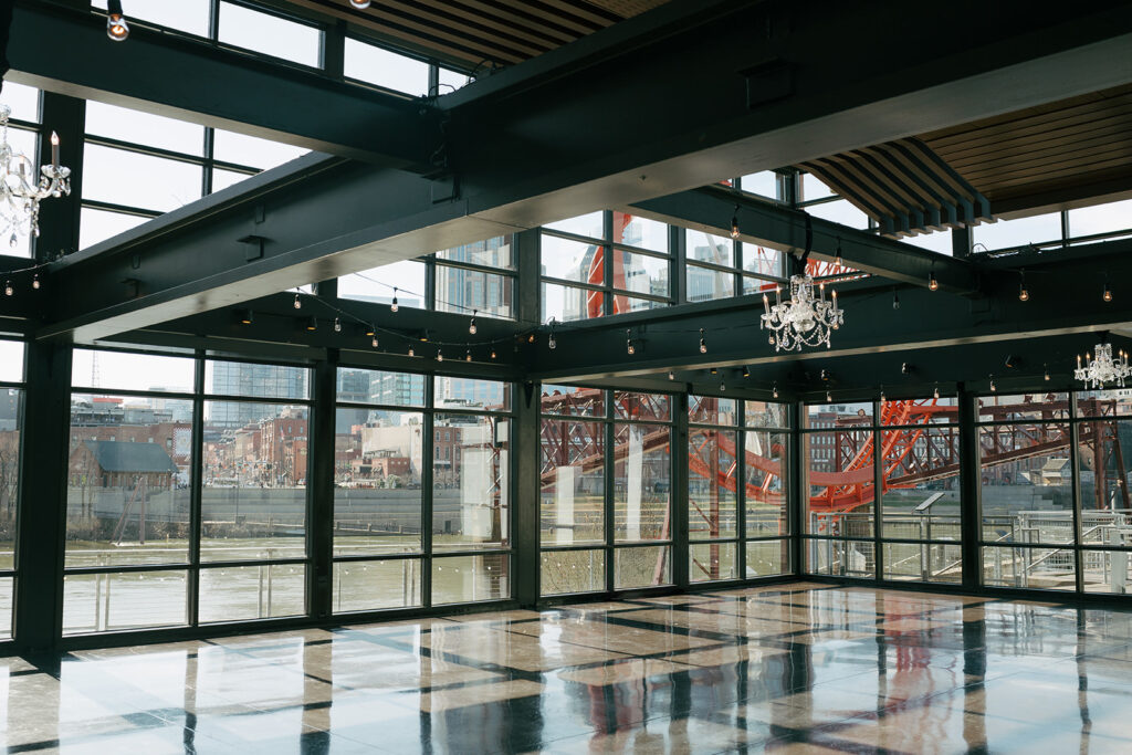 wedding venue with large industrial windows letting in natural light