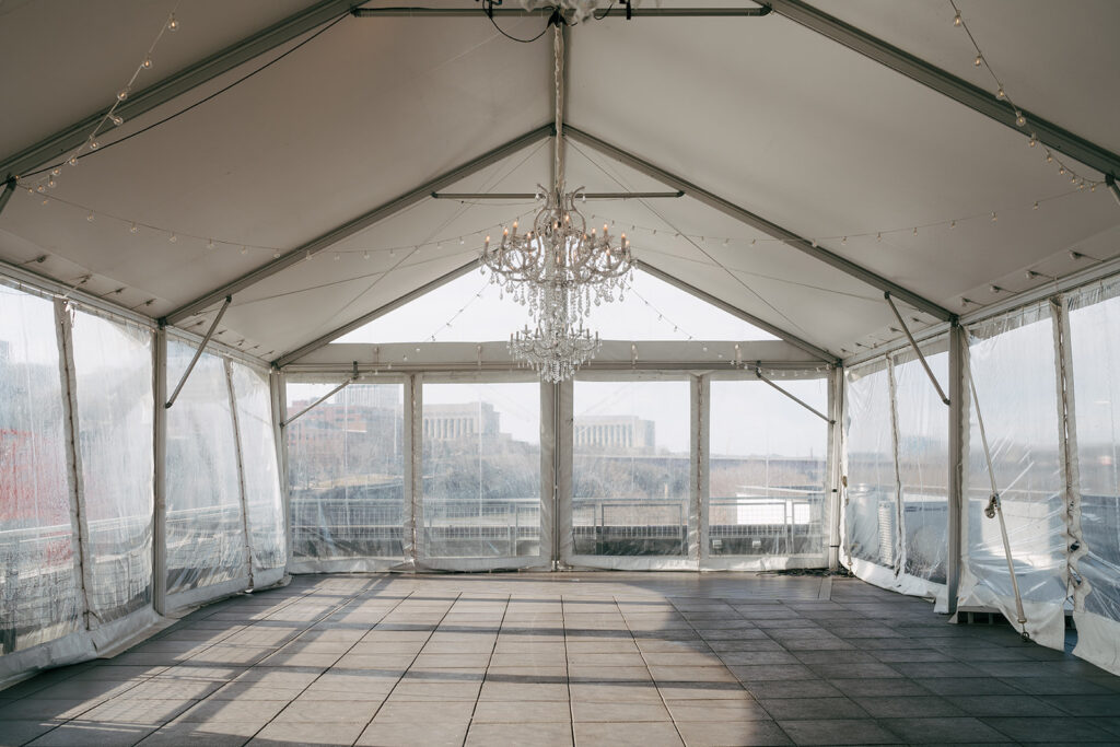 large white tent with a chandelier on Nashville wedding venue roof 