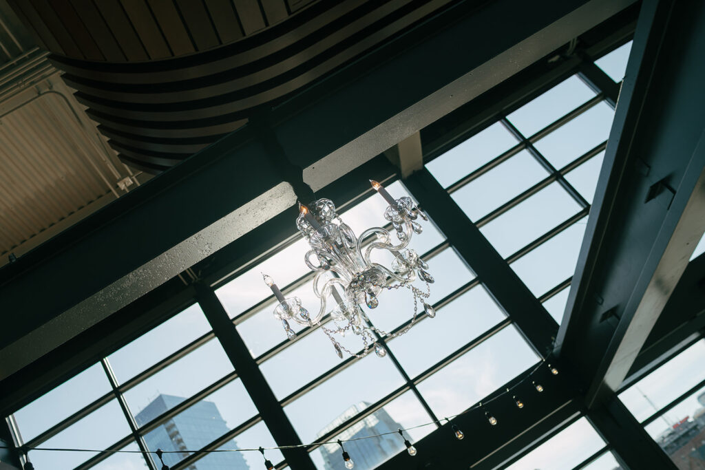 large window with natural light shining through featuring a crystal chandelier at Nashville wedding venue 