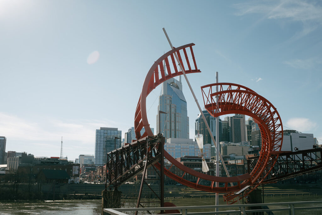 sculpture with downtown nashville skyline in the background 
